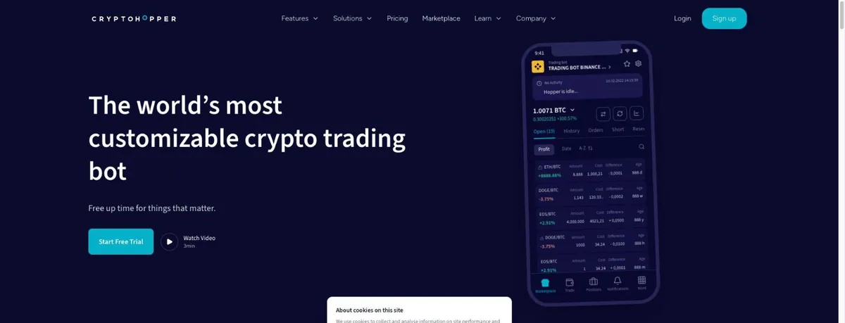 Cryptohopper homepage headline The world's most customizable crypto trading bot, with a Start Free Trial button and a phone mockup showing open positions